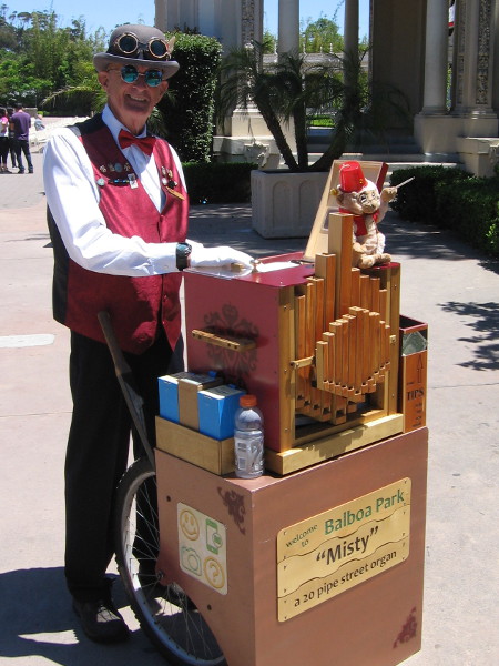 Friendly gentleman plays his 20 pipe street organ named Misty in Balboa Park.