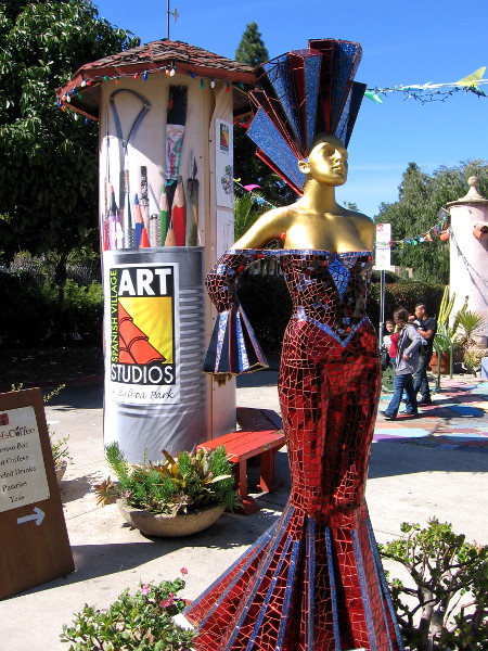 A sleek glass mosaic sculpture of Frida Kahlo greets visitors to Spanish Village Art Center!